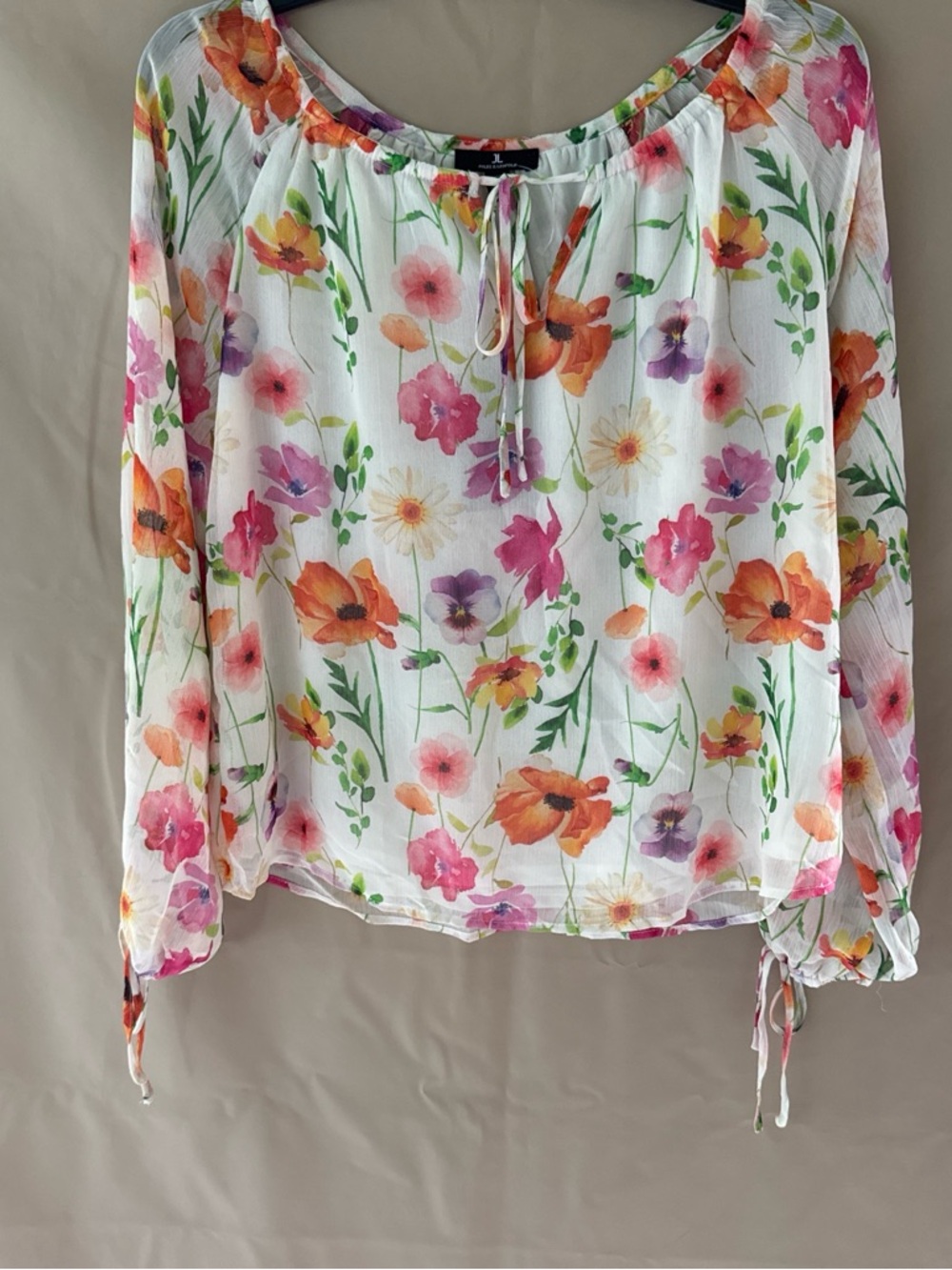 Women’s multicolored cream top.